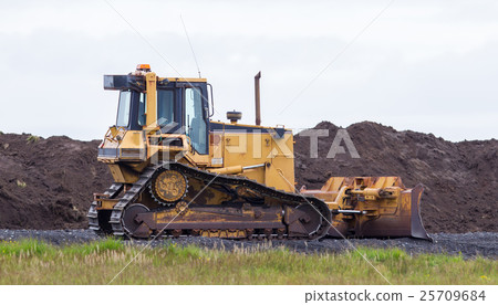 Bulldozer in the field Bulldozer in the field 25709684