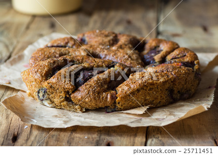Homemade eggless plum cake on vintage wood table 25711451