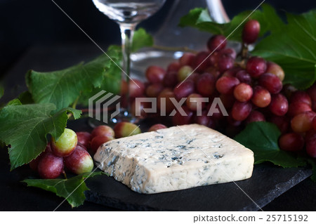 Blue cheese with grape background Blue cheese with grape background 25715192