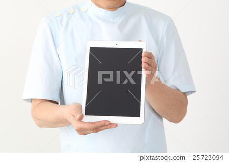 Middle-aged man with tablet (dental surgeon massager) 25723094