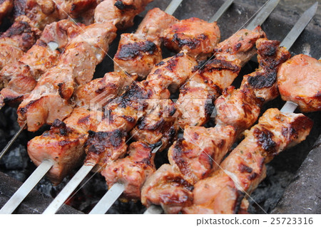 Meat porkis fried on the grill skewers at coals 25723316