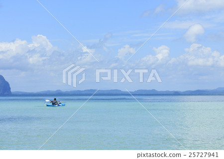 man kayaking in the sea. man kayaking in the sea. 25727941