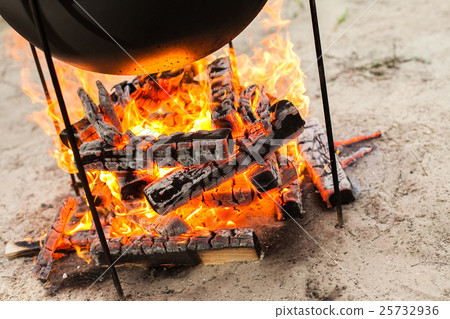 Cooking on a fire. Cooking on a fire. 25732936