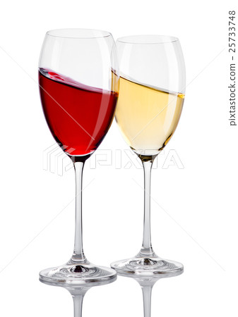 Glass of red and white wine in motion on white Glass of red and white wine in motion on white 25733748