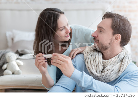 Pleasant delighted couple looking at each other Pleasant delighted couple looking at each other 25734150
