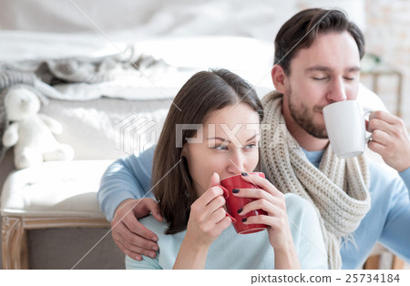 Pleasant thoughtful woman sipping tea 25734184