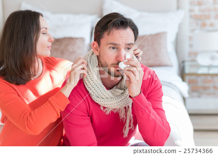 Beautiful loving wife caring about her ill husband Beautiful loving wife caring about her ill husband 25734366