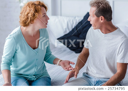 Choleric aged husband and wife quarreling Choleric aged husband and wife quarreling 25734795