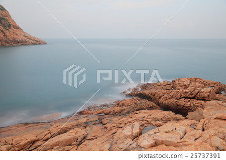 rocky sea coast and blurred water in shek o 25737391