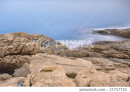 rocky sea coast and blurred water in shek o 25737720