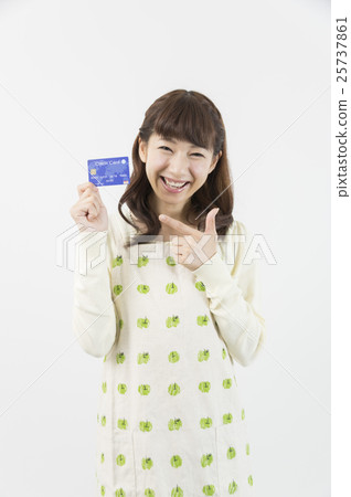 Housewife pointing to a credit card Housewife pointing to a credit card 25737861