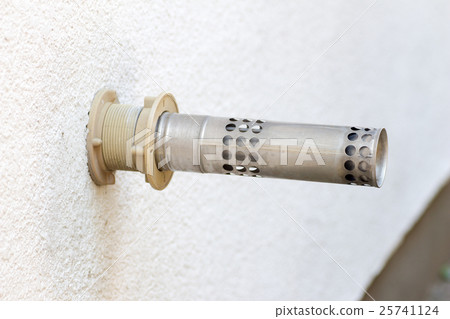 An exhaust pipe attached to the outer wall An exhaust pipe attached to the outer wall 25741124