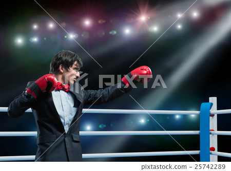 businessman with boxing gloves in the ring businessman with boxing gloves in the ring 25742289