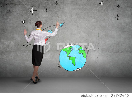 Rear view of businesswoman presenting drawn planet Rear view of businesswoman presenting drawn planet 25742640