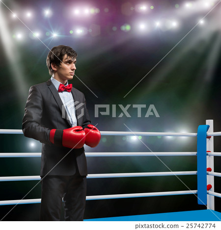 businessman with boxing gloves in the ring 25742774