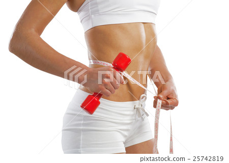 young athletic woman measuring waist young athletic woman measuring waist 25742819
