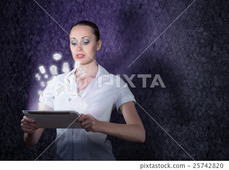 young attractive woman holding a tablet young attractive woman holding a tablet 25742820
