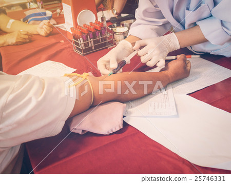 close up hand man and nurse taking a blood sample 25746331