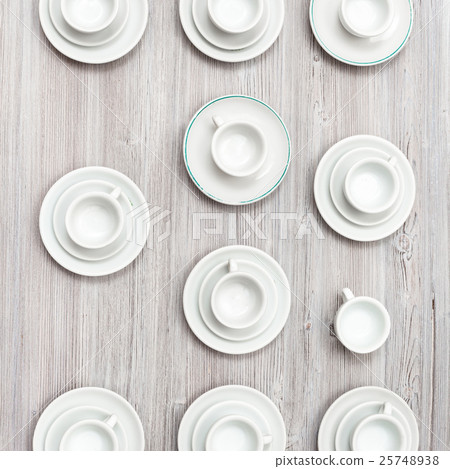 top view of several cups and saucers on gray table top view of several cups and saucers on gray table 25748938