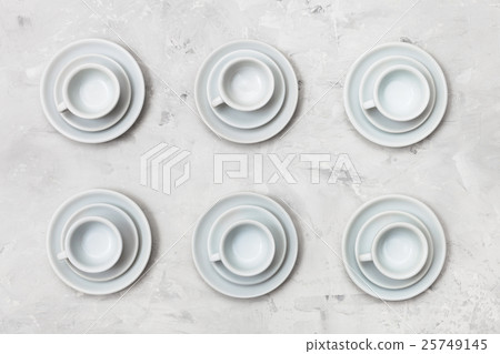 top view of six white cups and saucers on concrete 25749145