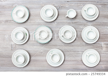 top view lot of cups and saucers on gray board top view lot of cups and saucers on gray board 25749334