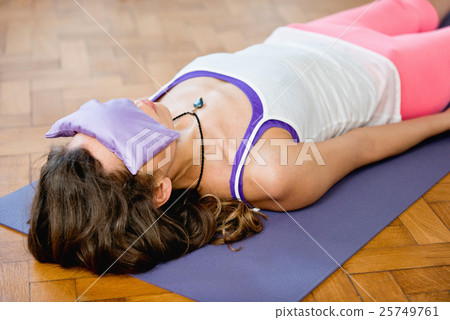 Savasana or corpse position in Yoga 25749761