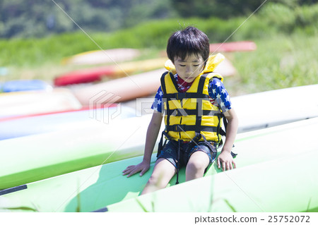 A boy in a life jacket 25752072