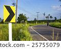 curve warning sign in the rural road, blurred face 25755079