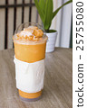 Thai tea smoothie on wooden table 25755080