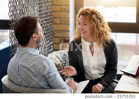 Woman talking to man and he is taking notes 25755701