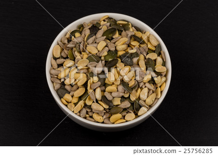 mixed seeds in wooden bowl 25756285