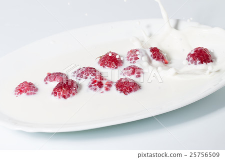 Raspberries Falls Into Milk 25756509