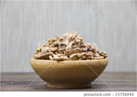 Walnuts in wooden bowl Walnuts in wooden bowl 25756848
