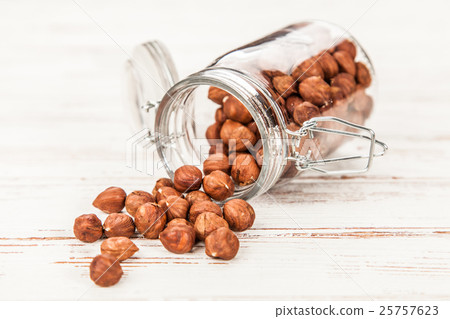 Hazelnuts closeup photo Hazelnuts closeup photo 25757623