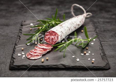 Salami on dark background 25757723