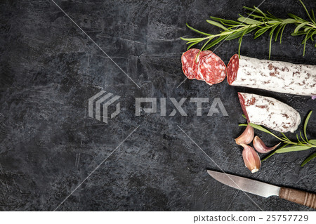 Salami on dark background 25757729