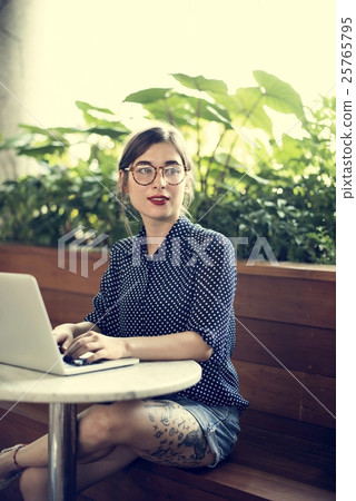Woman Sitting Alone Using Laptop Concept Woman Sitting Alone Using Laptop Concept 25765795