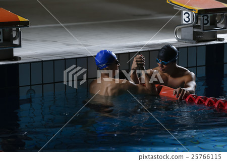 Swimming players who are pleased with each other Swimming players who are pleased with each other 25766115