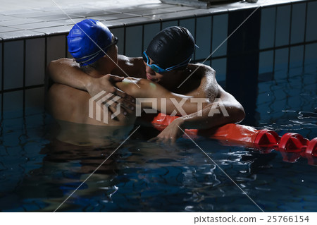 Swimming players who are pleased with each other Swimming players who are pleased with each other 25766154