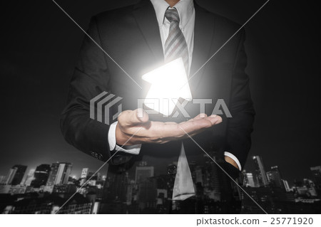 Businessman with turn up bright arrow on hand 25771920