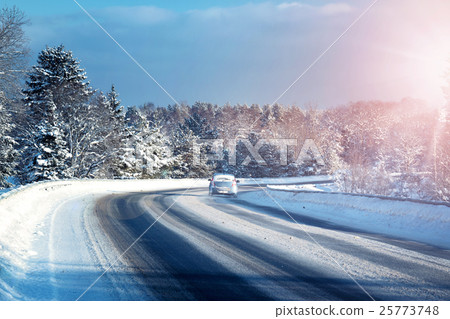 Car tires on winter road Car tires on winter road 25773748