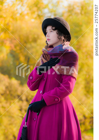 Portrait girl in bright crimson coat in sunny day Portrait girl in bright crimson coat in sunny day 25774207