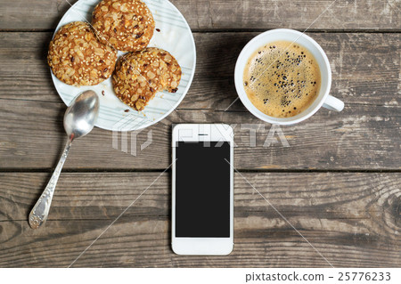 Morning coffee with cookies on a wooden table 25776233