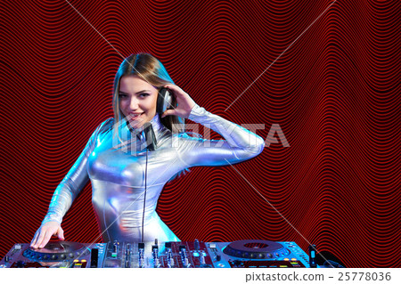 DJ girl on decks at the party 25778036