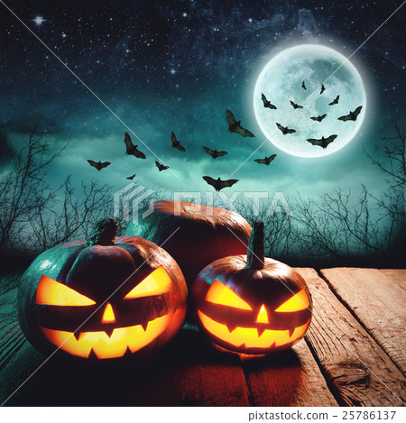 Stock Photo: Halloween Pumpkin. Glowing Jack in a dark mist