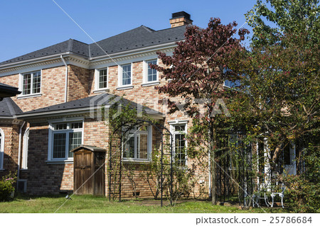 Western style model house with brick wall and white window 25786684