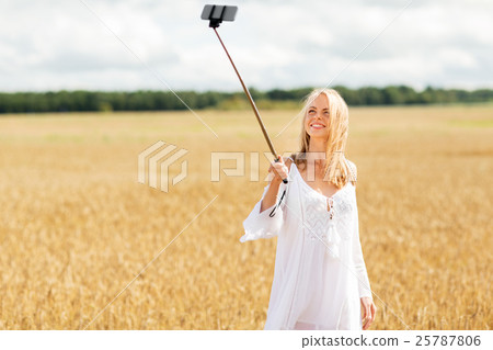 happy young woman taking selfie by smartphone 25787806