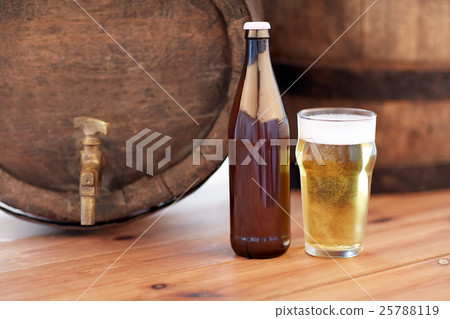 close up of old beer barrel, glass and bottle 25788119