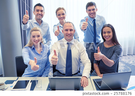 business people showing thumbs up in office 25788176
