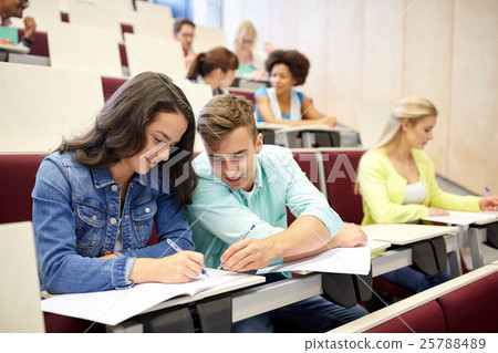 group of students with notebooks at lecture hall 25788489